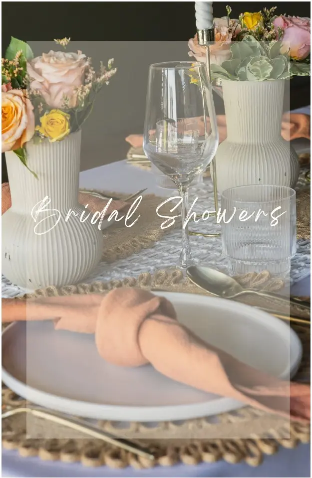 A table set with plates and cups on top of burlap.